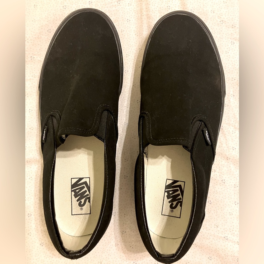 Men’s size 12 black classic Vans slip-ons.